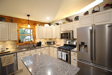 Open concept kitchen - large rustic u-shaped dark wood floor and brown floor open concept kitchen idea in Other with an undermount sink, raised-panel cabinets, white cabinets, quartz countertops, gray backsplash, stone tile backsplash, stainless steel appliances and two islands