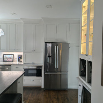 White inset cabinetry with walnut custom accents
