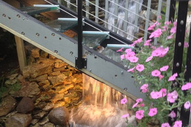Inspiration for a mid-sized timeless glass straight open staircase remodel in Columbus