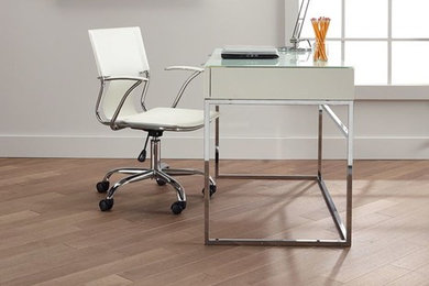 Study room - mid-sized modern freestanding desk light wood floor study room idea in Vancouver with white walls