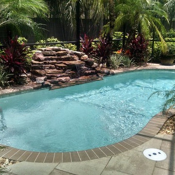 Therapy pool with natural rock waterfall