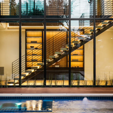 Modern Staircase &  Display Cabinet Hartford Overlooking An Outdoor Pool Project