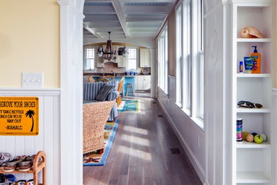 Inspiration for a mid-sized beach style entry hall in Portland Maine with yellow walls.