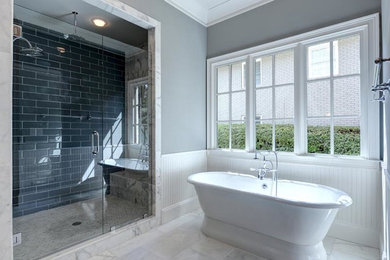 Large trendy master blue tile, gray tile and ceramic tile marble floor and white floor bathroom photo in Atlanta with gray walls and a hinged shower door