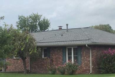 Example of a house exterior design in Other with a shingle roof