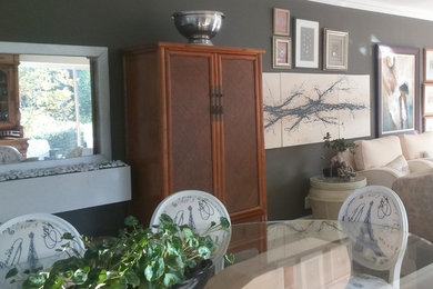Inspiration for an eclectic ceramic tile and beige floor living room remodel in Other with gray walls, a hanging fireplace and a stone fireplace