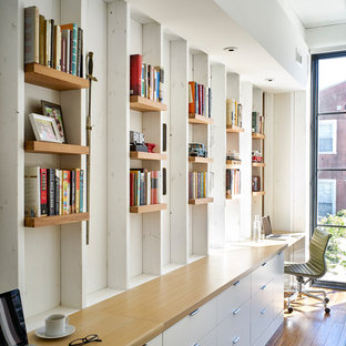 Inspiration for a contemporary study room in Philadelphia with white walls, bamboo floors, no fireplace and a built-in desk.