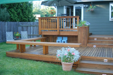 Deck - mid-sized traditional backyard deck idea in Seattle with no cover