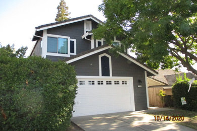 Example of a large cottage gray two-story mixed siding house exterior design in Sacramento