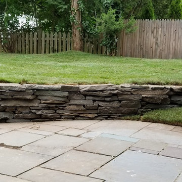 Sod installation and stacked stone wall
