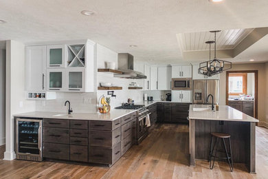 Transitional light wood floor kitchen photo in Indianapolis with an undermount sink, quartz countertops, white backsplash, subway tile backsplash, stainless steel appliances, an island and white countertops