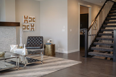 This is an example of a contemporary living room in Calgary with grey walls, dark hardwood floors and brown floor.