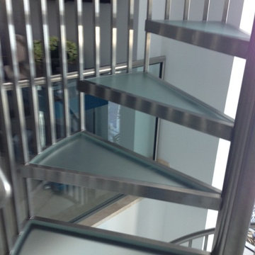 Stainless steel and obscure glass spiral staircase