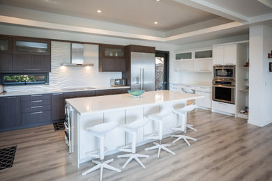 Inspiration for a contemporary u-shaped gray floor and coffered ceiling kitchen pantry remodel in Hawaii with flat-panel cabinets, white cabinets, stainless steel appliances and an island