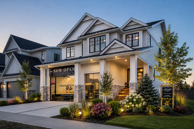 Mid-sized cottage white two-story mixed siding exterior home photo with a black roof