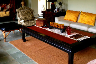 Living room - mid-sized asian formal and open concept slate floor and gray floor living room idea with green walls, no fireplace and no tv