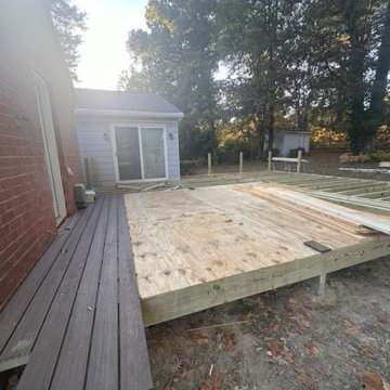 Floor framing for the porch and deck started, and composite decking is being ins