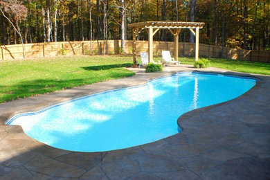 Inspiration for a mid-sized backyard custom-shaped pool remodel in Indianapolis