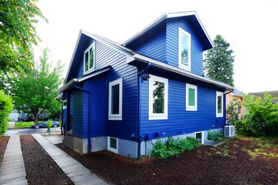 Small transitional blue two-story mixed siding and clapboard house exterior photo in Portland with a hip roof, a shingle roof and a gray roof