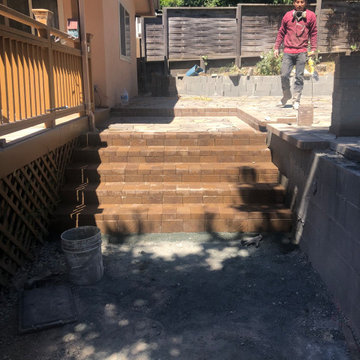 Pavers patio and returning wall and with smooth stucco