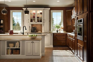 Eat-in kitchen - large traditional l-shaped ceramic tile eat-in kitchen idea in Other with multicolored backsplash, mosaic tile backsplash, stainless steel appliances and an island