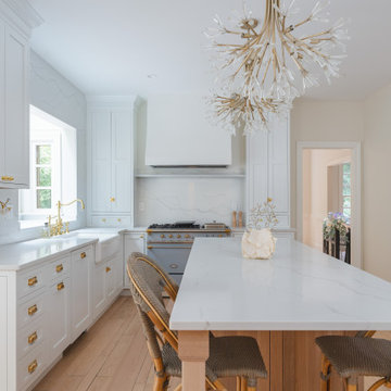 Château Charm: French-Inspired Kitchen Renovation with Plaster Hood Blue Stove a