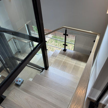 Project #136 | Modern Floating Staircase Encircling Glass Elevator