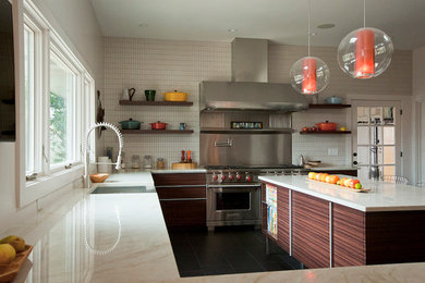 Example of a large trendy u-shaped dark wood floor kitchen design in Atlanta with flat-panel cabinets, dark wood cabinets, marble countertops, white backsplash, matchstick tile backsplash, stainless steel appliances and an island