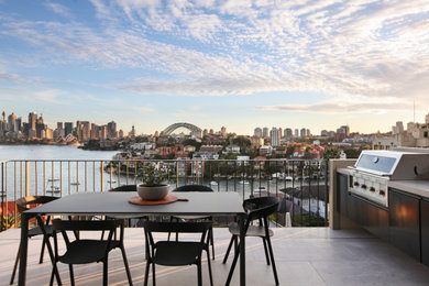 Mid-sized contemporary balcony in Sydney with no cover and metal railing for for apartments.