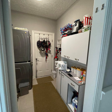 Laundry Room with Blue Painted Cabinetry and Sparkling White Quartz Countertops