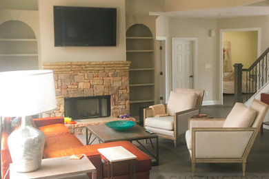 Family room - large craftsman open concept medium tone wood floor, gray floor and coffered ceiling family room idea in Atlanta with beige walls, a standard fireplace, a stacked stone fireplace and a wall-mounted tv