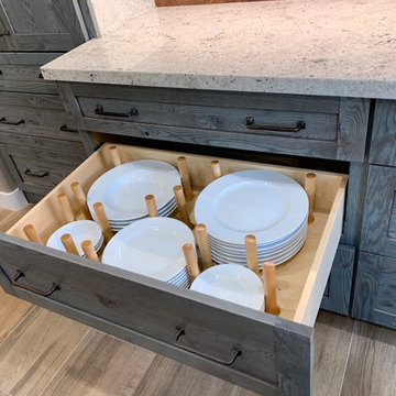 Plate divider in drawer, eliminates stretching to reach them in the upper cabine