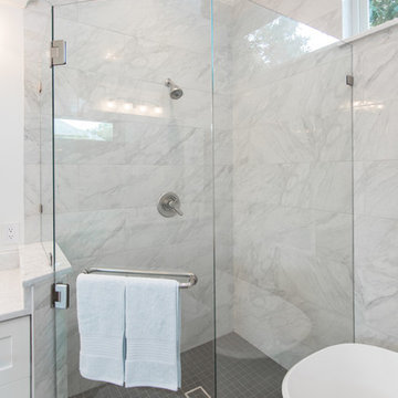 Bathroom | Elegant Custom Cabinets | Marble Tile & Freestanding Tub