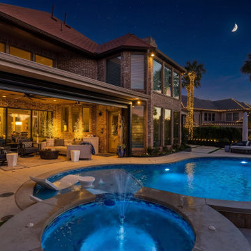 Custom Outdoor Living Pool Deck with Stamped Concrete & Turf