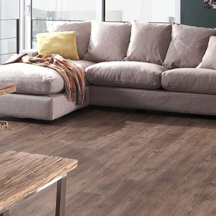 Idées déco pour une salle à manger ouverte sur la cuisine contemporaine avec un mur bleu et un sol en linoléum.