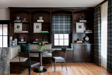 Elegant light wood floor and brown floor dining room photo in Dallas with white walls and no fireplace