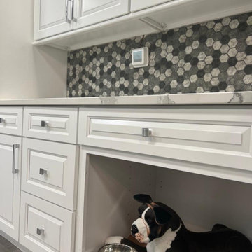 Laundry Room design with extra dryer and maximized storage space