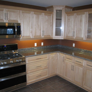 Mid-sized contemporary kitchen pantry ideas - Example of a mid-sized trendy l-shaped kitchen pantry design in Toronto with light wood cabinets, granite countertops, raised-panel cabinets, stainless steel appliances and no island