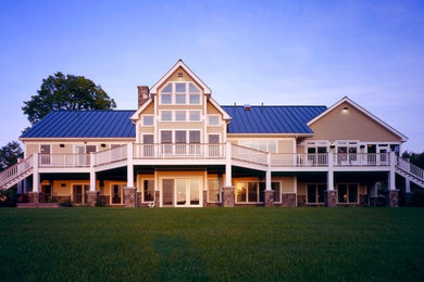 Inspiration for a huge timeless brown two-story concrete fiberboard gable roof remodel in Boston