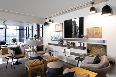 Inspiration for a large modern loft-style family room remodel in Chicago with white walls