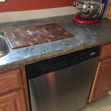 Chisel Edge Concrete Countertops with Walnut and Oak Chopping Board