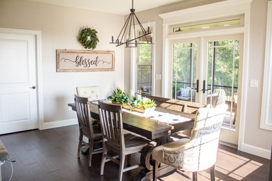 Inspiration for a mid-sized farmhouse medium tone wood floor and brown floor kitchen/dining room combo remodel in St Louis with beige walls