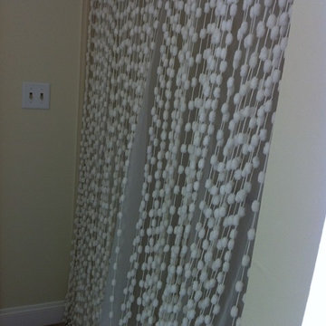 Bathroom Renovation with white shower curtains