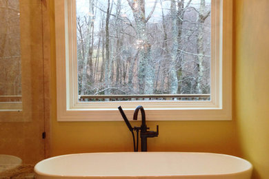 Large elegant master beige tile and stone tile travertine floor bathroom photo in Charlotte with an undermount sink, furniture-like cabinets, medium tone wood cabinets, granite countertops, a one-piece toilet and beige walls
