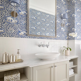 Traditional bathroom in Brisbane with recessed-panel cabinets, beige cabinets, white tile, blue walls, mosaic tile floors, a vessel sink, white floor, white benchtops, a single vanity, a floating vanity and wallpaper.