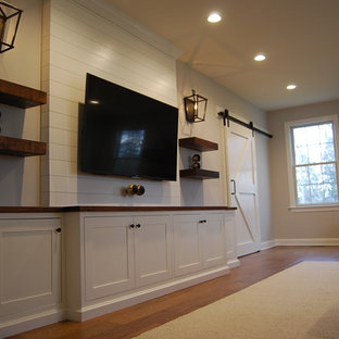 Home theater - small country home theater idea in Philadelphia with a wall-mounted tv