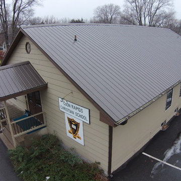 Metal roof and seamless gutters on a Church building