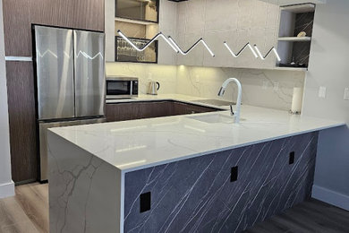 Example of a mid-sized trendy u-shaped vinyl floor and gray floor open concept kitchen design in Miami with an undermount sink, glass-front cabinets, dark wood cabinets, quartz countertops, white backsplash, quartz backsplash, stainless steel appliances, an island and white countertops