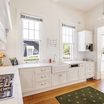 Kitchen with Antique White Milarno Style Doors