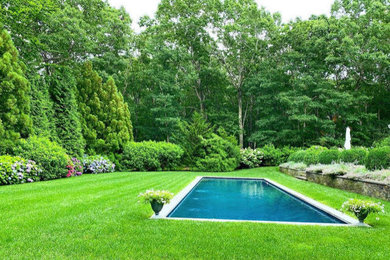 Inspiration for a large contemporary privacy and full sun backyard stone landscaping in Other for summer.
